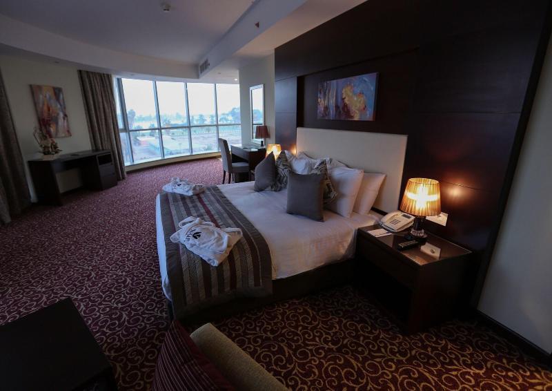 Tolip El Forsan Hotel Ismailia Exterior foto A bedroom at the hotel